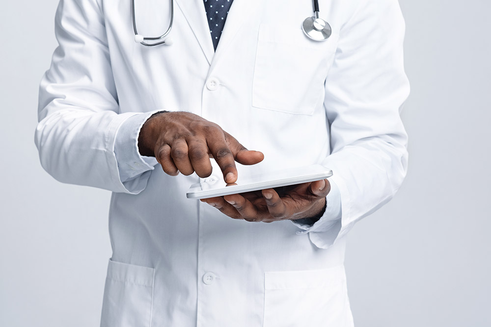 African Doctor Using Tablet